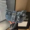 Bolsa de Silla de Montar Retro de Gama Alta 2026 Nueva Bolsa de Motocicleta de Mezclilla para Mujeres Nicho Versátil Bolso Cruzado Bolso de Hombro Único para Viajes Diarios