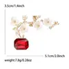 Broche de flor de ciruelo en maceta de moda transfronteriza europeo y americano, broche de planta de diamante creativo, pines de ropa simples y frescos