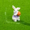 Nuevo producto transfronterizo: Lindo peluche de conejo sosteniendo un huevo de Pascua, accesorios de decoración DIY, mini adornos colgantes