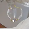 Pulseira Olho de Gato Azul Perolado em Formato de Anel de Saturno, Joia de Luxo Leve de Nicho de Alta Qualidade, Pulseira Exquisita e Elegante com uma Vibe Cool