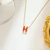 Diseño francés de lujo ligero collar con gota de aceite letra pendientes de botón para mujer nicho minimalista celebridad de internet cadena de clavícula joyería de venta caliente transfronteriza