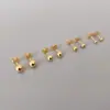 Moda sencilla frijol pequeño de oro oro amarillo 18K cuentas para oreja aretes tamaño cuentas de acero aretes de acero de titanio venta al por mayor