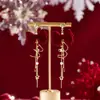 Brincos Rotativos de Meteoro de Natal Outono e Inverno Ano Novo Brincos com Laço Vermelho Doce Design de Nicho Sentido Design Feminino Atacado