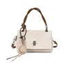 Bolsa de ombro feminina retrô da moda Yuezizi 2026 nova versão coreana bolsa de mão simples tecida bolsa transversal versátil fashion