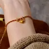 Pulseira Tendência de Corda Vermelha Tecida Estilo Chinês para o Ano do Zodíaco, Apresentando um Design Chinês Tradicional com uma Pequena Cabaça Dourada para Empilhar