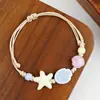 Jingdezhen Navidad Pulsera de Cuerda Trenzada de Cerámica Pulsera de Trébol de Cuatro Hojas Joyería Artística Hecha a Mano Venta al por Mayor Pulseras de Cerámica para Atracciones Turísticas