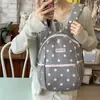 Mochila pequena de bolinhas estilo coreano para meninas do ensino fundamental e médio, mochila leve de grande capacidade para deslocamento ao ar livre, mochila escolar à prova d'água