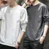 Temporada de primavera y otoño, camiseta lisa popular de manga larga, corte holgado, cuello redondo, unisex, top simple y versátil