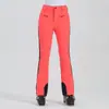 Nuevos pantalones de esquí para mujer, estilo europeo y americano, corte ajustado, alta elasticidad, a prueba de viento, impermeables, cálidos, pantalones de nieve con bloques de color para mujer