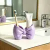 Soporte para cepillos de dientes con forma de lazo Sin instalación Plástico Soporte de almacenamiento Baño Dormitorio Tipo bolígrafo Soporte de exhibición para cepillos de dientes