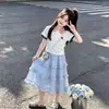 2026 Lindo Dibujo Animado Oso Pequeño Solapa Manga Corta Top Niñas Verano Moda Elegante Falda de Encaje Conjunto de Dos Piezas