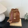 Bolso de hombro retro de gran capacidad transfronterizo para mujer, nuevo bolso cubo casual simple de verano 2026, bolso bandolera para debajo del brazo