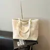 Bolsa Tote Grande de Viagem Transfronteiriça para Mulheres 2026 Verão Novo Estilo Alto Valor Leve Luxo Nicho Ombro Axila