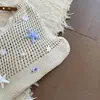 Bolso personalizado estilo resort al por mayor para mujer, nuevo bolso de hombro tejido calado para el verano 2026, bolso de axila de moda