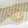 Anillo de acero de titanio con personalidad de moda japonesa y coreana, con forma de gota de agua pequeña, ligero y de lujo, para mujeres, fabricantes al por mayor, combina con todo.