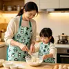 Nuevo delantal de cocina temático de Navidad para padres e hijos, con un lindo diseño de caricatura, adecuado para uso doméstico y que ofrece protección contra salpicaduras tanto para adultos como para niños.