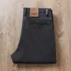 Pantalones casuales rectos holgados de algodón lavado elástico de sarga de alta gama para hombre, versátiles para negocios y trabajo, otoño e invierno 2023