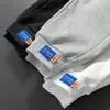 Pantalones Cortos Casuales de Algodón Puro para Hombre con Cordón Moda Deportiva Pierna Larga Color Sólido Combinan con Todo Pantalones de Moda para Adolescentes Explosivos