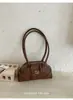 Bolsa de axila com textura de nicho feminina 2026 novo estilo bolsa de mão moderna bolsa de boliche versátil para o dia a dia bolsa de ombro única bolsa concha