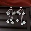 Pendientes de borla con flor de trébol de circonita vintage con un toque de alta gama, pendientes versátiles y de moda al por mayor