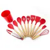 Venta al por mayor de fábrica suministros de cocina juego de espátulas de silicona con mango de madera de 11 piezas para cocinar en casa
