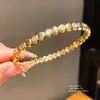 Pulsera geométrica de circonita chapada en oro real de 18k, sensación de lujo ligero de alta gama, diseño de nicho, joyería versátil al por mayor