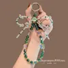 Cadena de Teléfono Popular de Cuentas de Cristal de Colores Bolso Corto de Muñeca Llavero Anti-Pérdida Funda de Teléfono para Mujer Correa