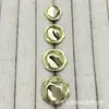 Botones metálicos de forma irregular y texturizados para trajes, abrigos de punto de lana y otras prendas.; Botones decorativos simples y versátiles, adecuados para coser a mano