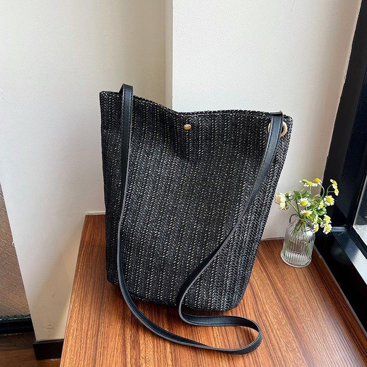 编织包女包新款潮2024夏草编简约百搭小清新水桶包个性单肩斜