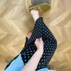Falda de lunares negros para mujer, nuevo estilo de otoño, talla grande, adecuada para figuras tipo pera, de cintura alta, adelgazante, con abertura, falda de línea A
