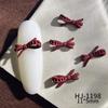 Nuevos accesorios de arte de uñas con pintura en aerosol de aleación, accesorios de arte de uñas de la suerte de Año Nuevo rojo de otoño e invierno, lazos huecos conjoined