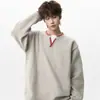 Suéter de punto de cuello en V con bloques de color, de punto falso de dos piezas, cosido a mano para hombre, marca de tendencia de invierno nueva, holgado y grueso, adecuado como capa interior