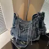 Bolsa de Ombro Único em Jeans Macio Retrô Feminina de Nicho Simples para o Dia a Dia Bolsa Tote com Cordão de Laço Versátil Elegante Bolsa Transversal