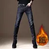 Coleção de primavera de Hong Kong: Calça jeans preta pura de alta qualidade para homens, corte slim, perna afunilada, elástica, adequada para uso business casual na primavera e no outono