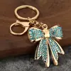 Anel de chaveiro de liga de zinco em formato de laço com strass, pingente de chave de metal, acessório DIY para chaveiro de carro e bolsa