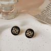 Pendientes de camelia de oro negro con fragancia de lujo y luz para viajeros, elegantes pendientes de flores esmaltadas de alta gama que combinan con todo.
