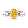 Transmisión en Vivo Más Vendido Anillo Huevo de Paloma Cortado Flor de Hielo de Piedra Preciosa de Color para Mujer Incrustado con Diamante de Alto Carbono Anillo de Mariposa Fabricante Dropshipping