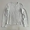Diseño cosido, suave y cómodo, estilo casual y relajado, camiseta de manga larga para mujer, cuello redondo, color liso, versátil, adelgazante y se puede usar como capa base