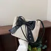 Bolso de Hombro Tejido de Paja Elegante de Verano para Mujer 2026 Nuevo Estilo Temperamento Suave Bolso Cubo con Lazo Bolso de Hombro Versátil