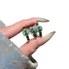 Anillo con hebilla de herradura de jadeíta natural al por mayor del fabricante para Xiaohongshu con incrustación de plata s925, diseño fresco y simple