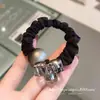 Diseño minimalista, scrunchie de cristal con cuentas grises, banda de goma de alta elasticidad para coleta baja, anillo para el pelo para mujer