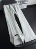 Pantalones de chándal de retazos a cuadros estilo americano para hombre, nuevo modelo 2026, sensación de alta gama, pantalones rectos holgados, pantalones casuales versátiles de pierna ancha