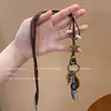 Colar de Metal Antigo Retro Estilo Étnico Boêmio Simples Versátil Pingente de Anel Longo 2025