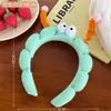 Yu Shuxin com faixa de cabelo fofa divertida faixa de cabelo de pelúcia de olhos grandes faixa de cabelo de caveira alta top lavar rosto pressão faixa de cabelo foto menina