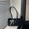 Bolsa de axila de moda casual de nicho coreano para el trabajo 2026 Nueva Simple Elegante Versátil Textura Bolso de hombro único