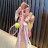 Llavero de cara sonriente de tenis con borla de cara sonriente colgante para mochila llavero de coche deportivo pequeño regalo al por mayor