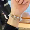 Nuevo Pulsera de Campana de Amor de Gato Kt para Mujer Lujo Ligero de Aspecto Caro Moderna Mejor Amiga Pulsera Diseño de Nicho Ins Más Fácil de Combinar