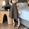 Falda larga para mujer para otoño e invierno, nueva falda de lana de cintura alta con dobladillo amplio, que cubre la cadera y estiliza, falda de lana de longitud media en color café
