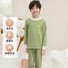 Nuevo conjunto de ropa interior térmica para niños de otoño e invierno, hecho con lana y seda, engrosado para abrigar, antibacteriano y de diseño sin costuras, adecuado tanto para niños como para niñas, para usar en casa y como pijama