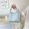 Bolso de Mujer de Gama Alta Tipo Cubo para Llevar en la Mano 2025 Verano Nuevo Diseño de Moda Bolso de Hombro Simple Versátil Bolso Cruzado Casual